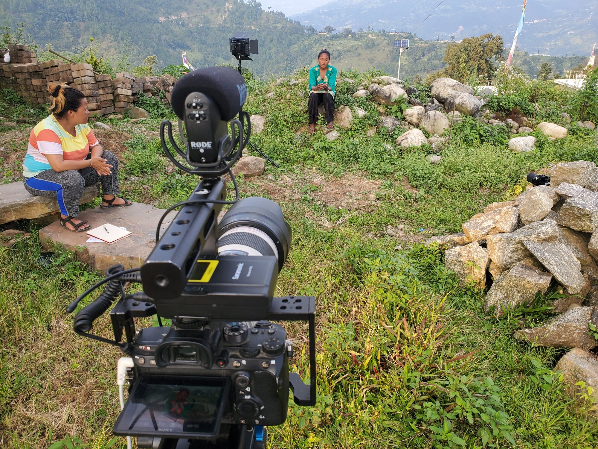 Mahdi Khmili filming an interview inside a home in Giranchaur
