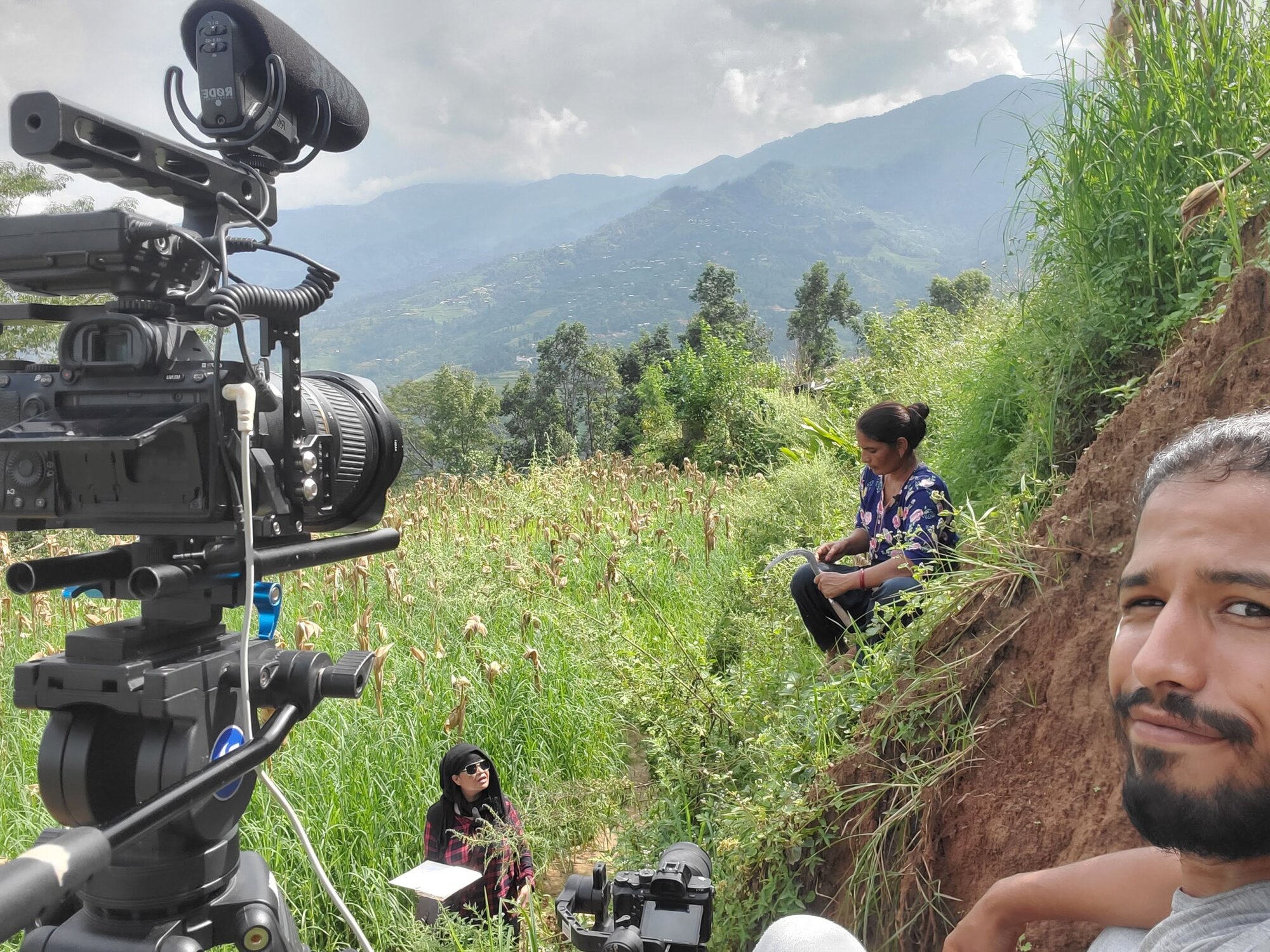 Behind the scenes filming an interview on a hillside in Sindhupalchok