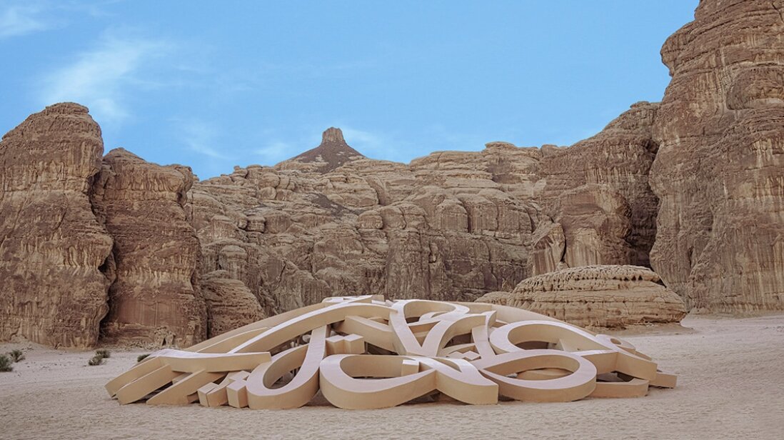 Mirage Al Ula — eL Seed's sculptural calligraphy installation among the rock formations of AlUla