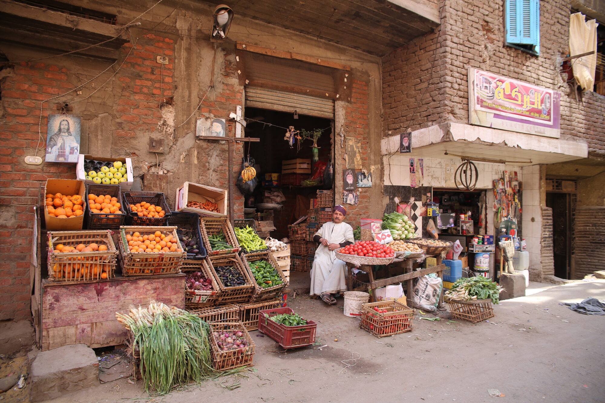 A fruit and vegetable vendor at his stall in Cairo