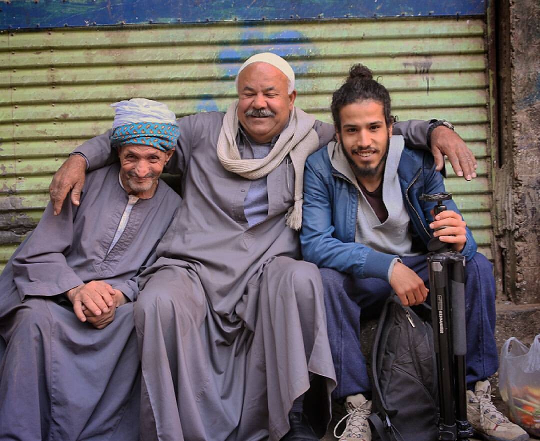 Mahdi Khmili sitting with two local residents